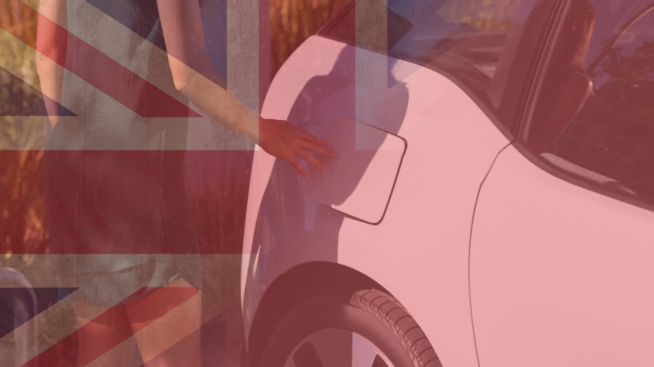 전기 자동차를 충전하는 여성 위에 영국  ⁇ 발