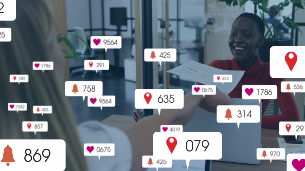 Animation of social media icons over business people in office
