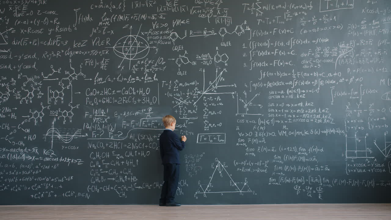 Young Student in front of a Blackboard Full of Math Equations
