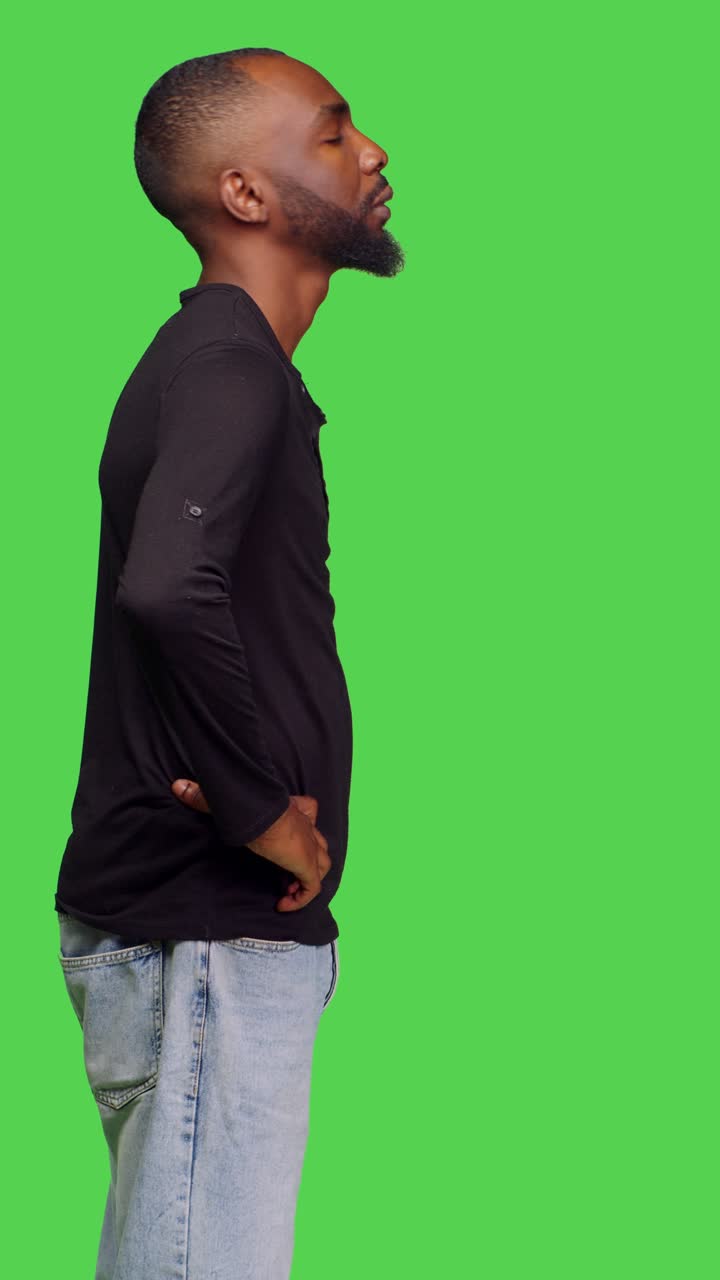 Vertical video: Profile of african american man acting disappointed and calling over