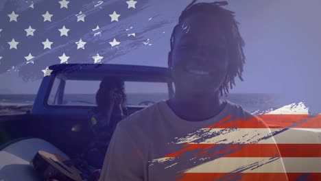 animation of american flag drawn over mixed race couple on beach by seaside
