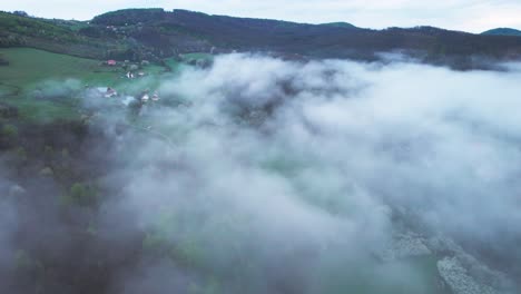 aerial shot overhead low-lying clouds at the base of the lower tatras mountains