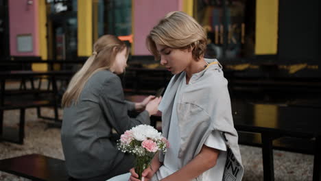 nervous teenage boy with a flower bouquet