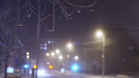 winter street light at night, establisher shot of snowy city, blurred background