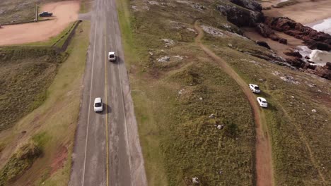 car driving on coastal road along punta ballena peninsula, punta del este in uruguay