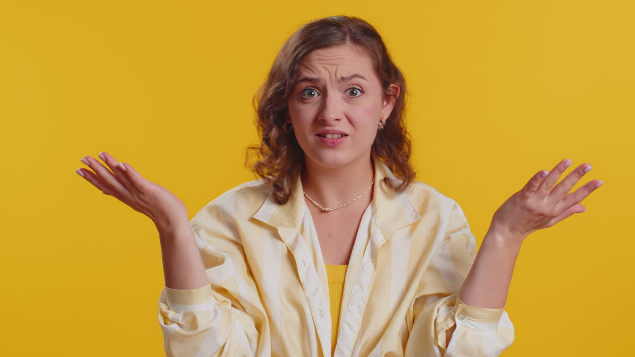 Woman raising hands in indignant expression ask why what reason of failure demonstrating disbelief