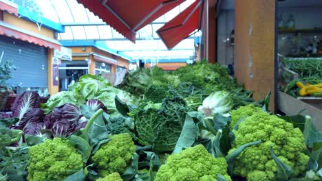 romanesco broccoli and other vegetables on a stand of a roman market