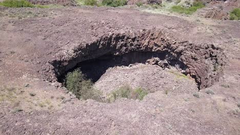 aerial orbits deep pothole eroded in volcanic rock by ice age flooding