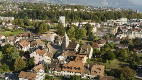 Aerial-orbit-around-church.-Corsier-sur-Vevey,-Vaud---Switzerland