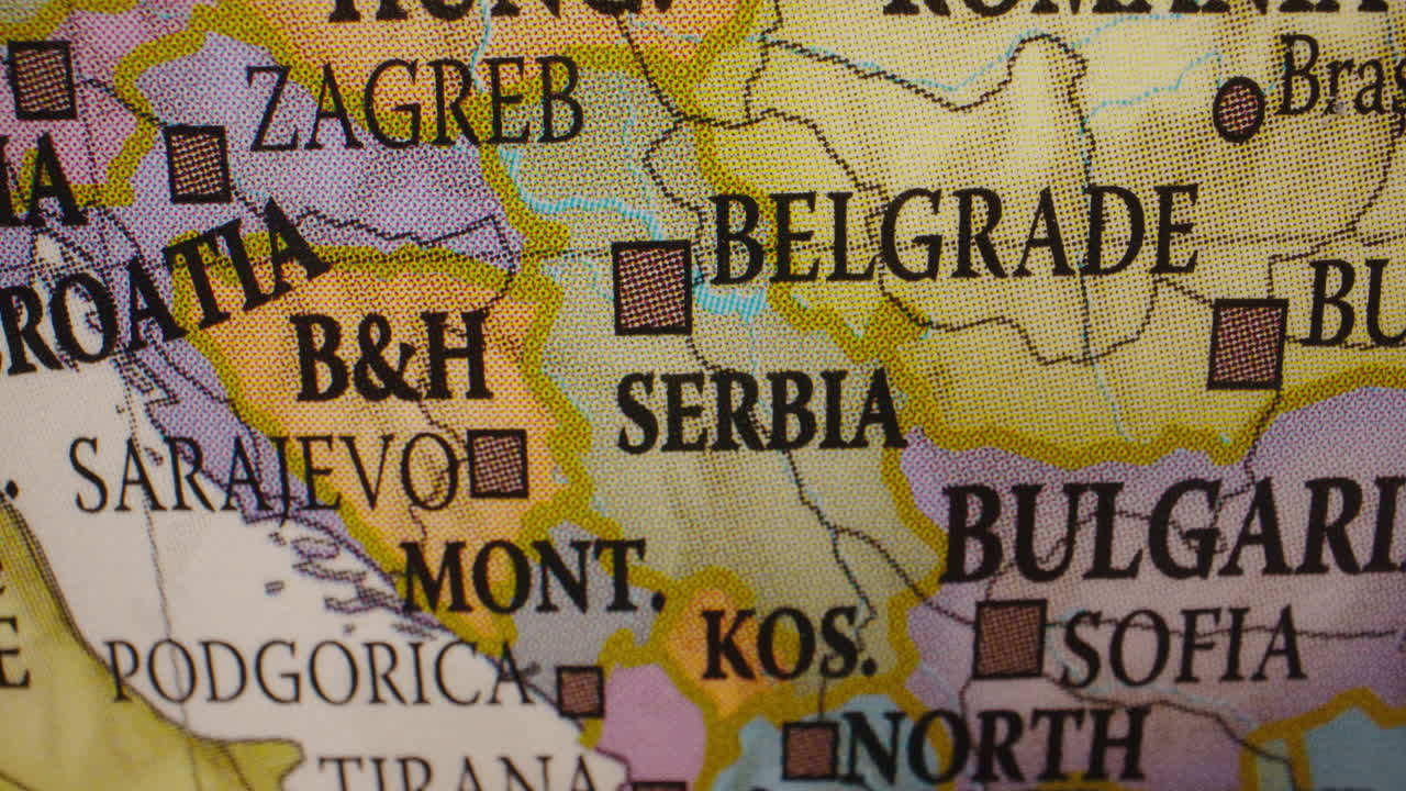 Close-up of a globe displaying Balkan countries and cities