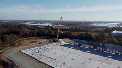 A-drone-orbit-of-a-heavy-crane-lifting-a-large-concrete-panel