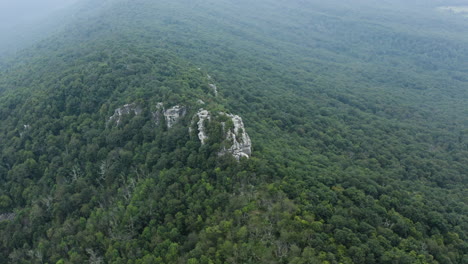 An-aerial-shot-of-Big-Schloss-and-Great-North-Mountain-in-the-evening-in-the-summer,-located-on-Virginia-West-Virginia-Border-within-the-George-Washington-National-Forest