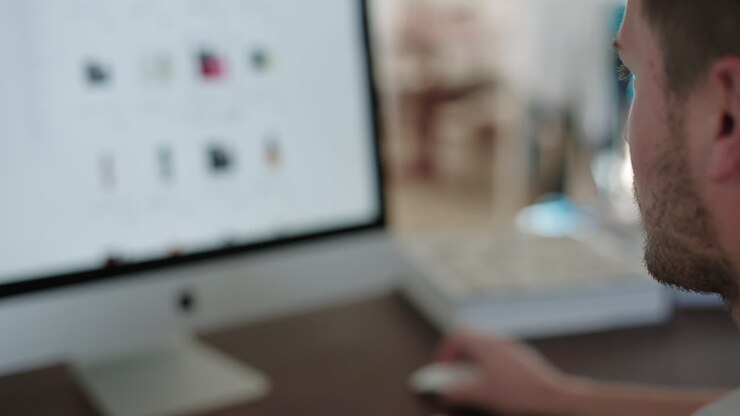 Man using computer to browse online products