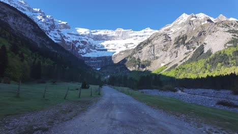 hiking on a path toward the cirque de gavarnie, a unesco site in the french pyrenees.