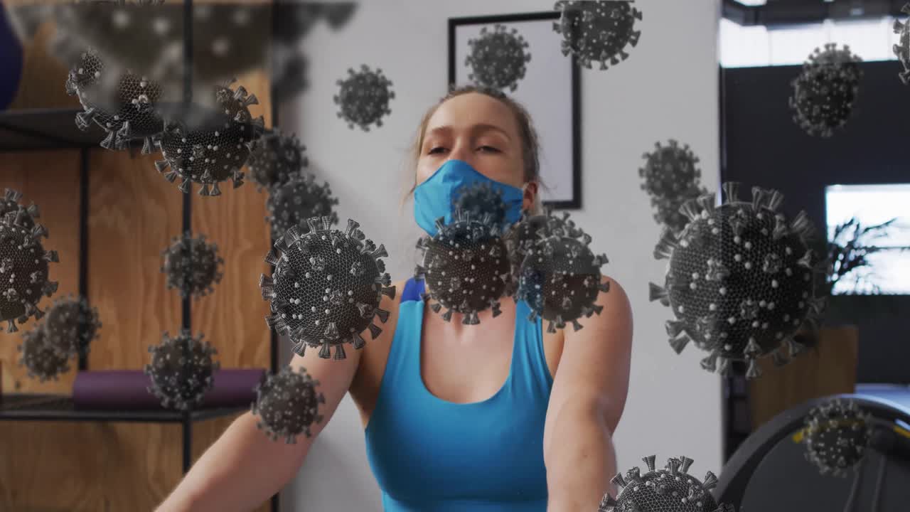 Superposición viral retrocediendo revelando a un entusiasta del fitness con mascarilla haciendo ejercicio de remo para impulsar el cardio.