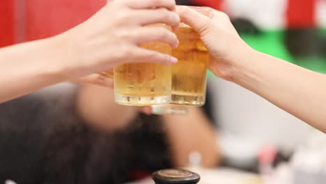 friends toasting with drinks in a restaurant