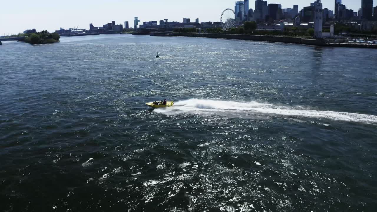 A jet boat racing across the St. Lawrence River in Montreal, offering tourists an adrenaline-fueled ride. The river's waves and the city skyline create an exhilarating scene. Tourist destination.