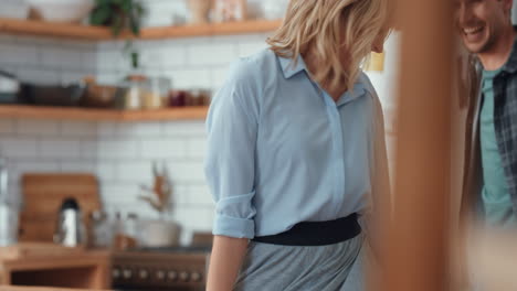 Dance,-love-and-couple-dancing-in-the-kitchen