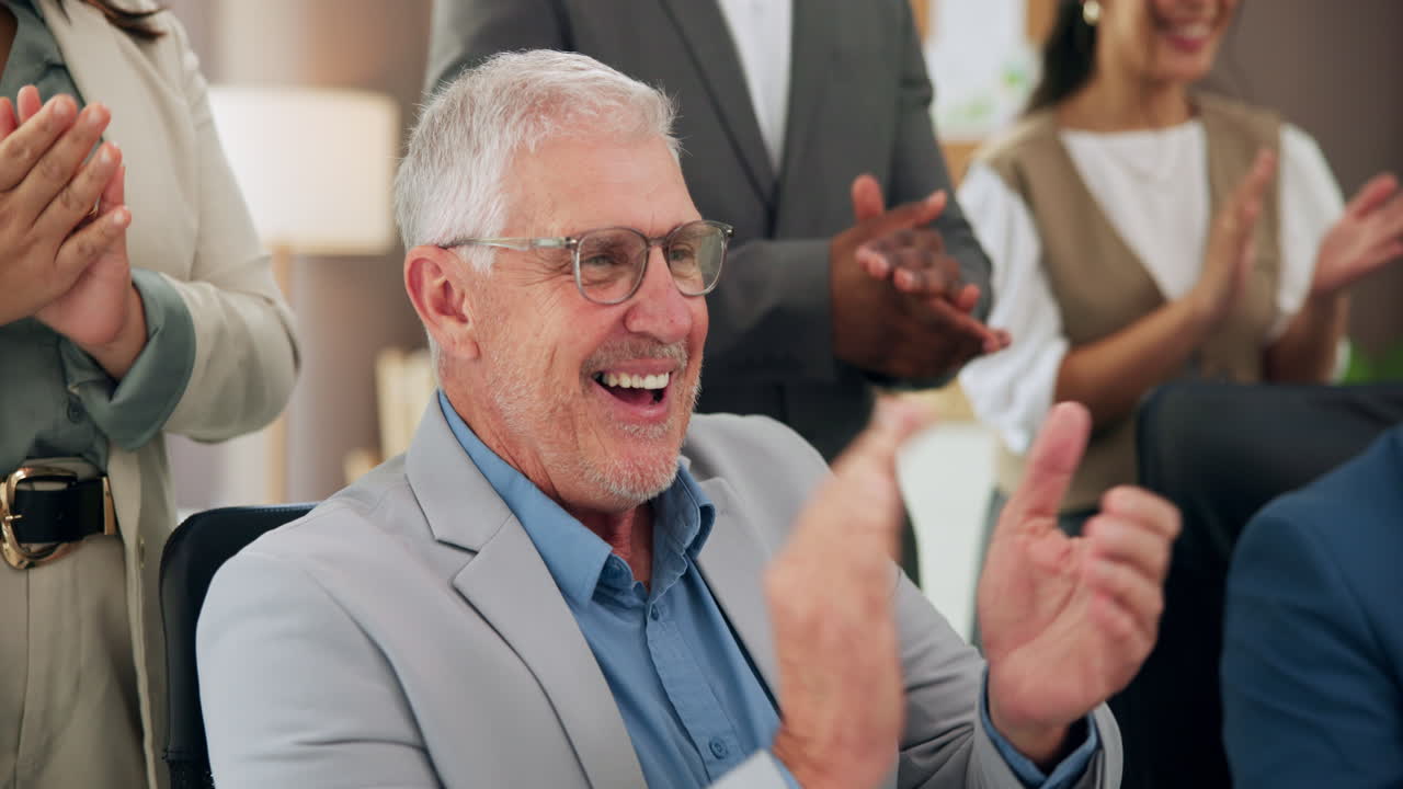Happy Senior Business Man Clapping and Smiling in a Meeting