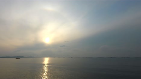 a sunrise view in coastal road during a cloudy morning