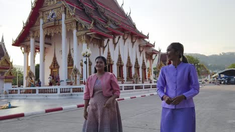 women walking at thai temple