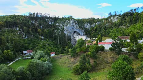 aerial 4k drone footage of renaissance predjama castle in postojna