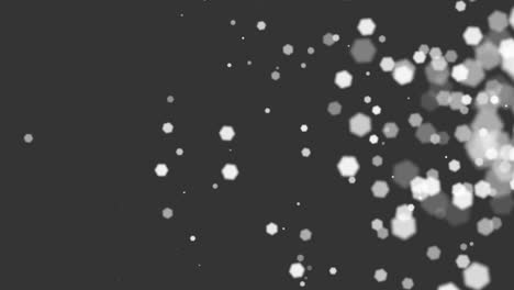 flying white round particles with glitters on fashion black gradient