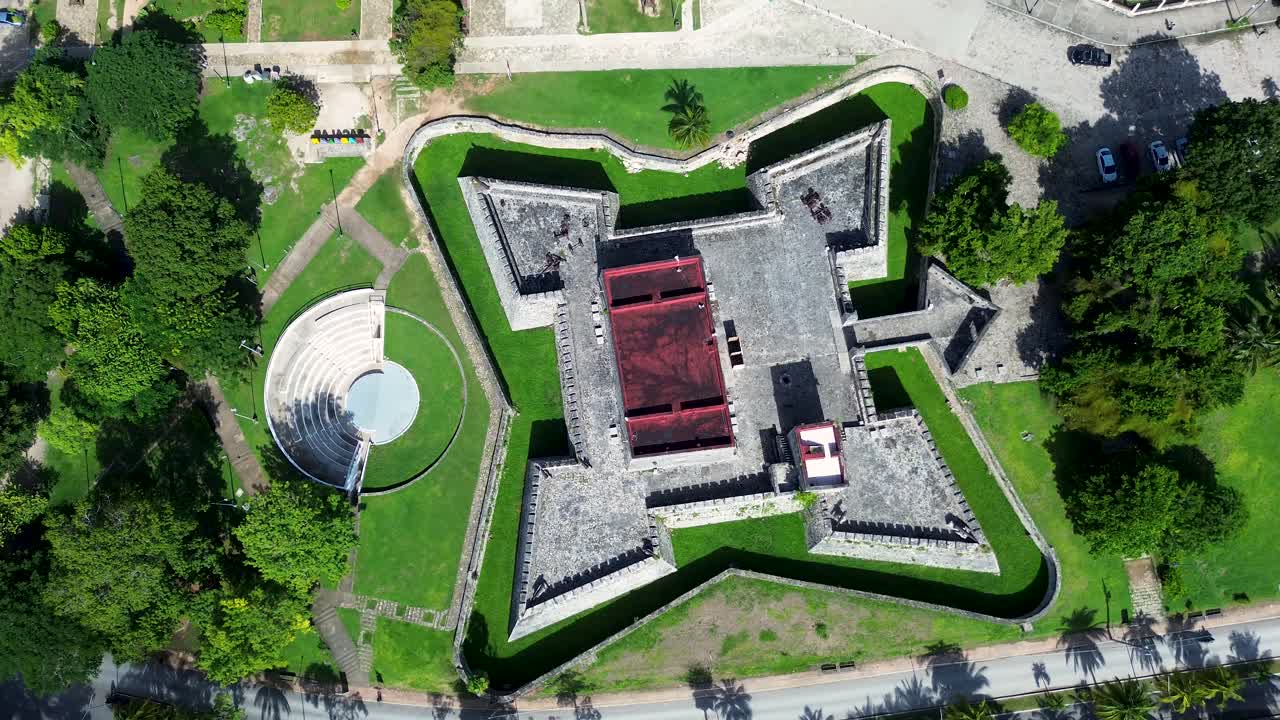 Drone aerial landscape of historic fortress castle of San Felipe in Bacalar old town square with roads streets of Mexico Quintana Roo travel tourism architecture tour