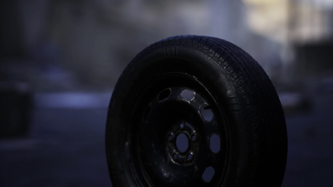 Abandoned tire on a deserted street in a city after a storm