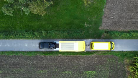 Black-vintage-car-drives-into-a-trailer