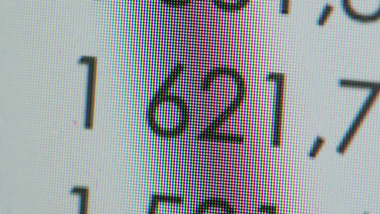 Close-up of Digital Screen Displaying Scrolling Numbers
