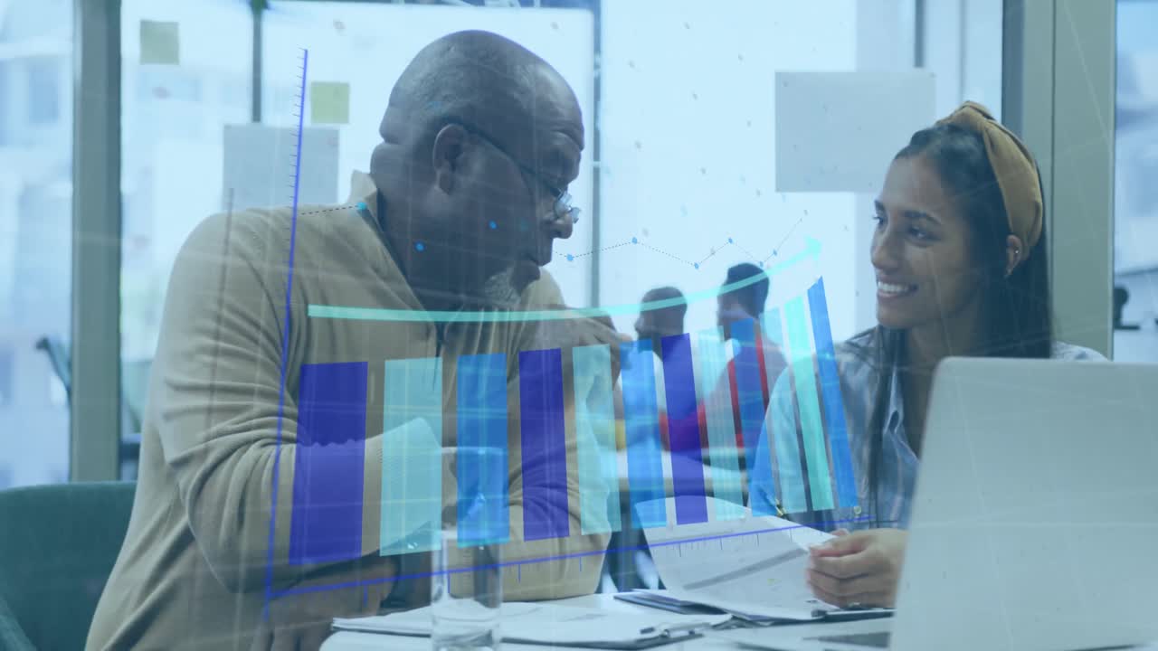 Animation of arrow on bar graph over diverse coworkers sharing ideas on desk in office