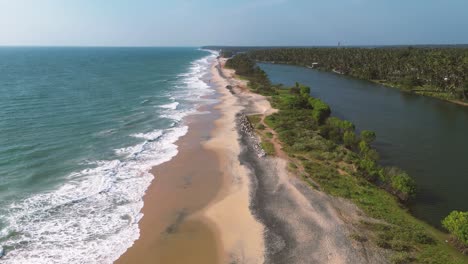 Big-lake-and-beach-surrounded-by-Palm-trees---Kerala,-South-India