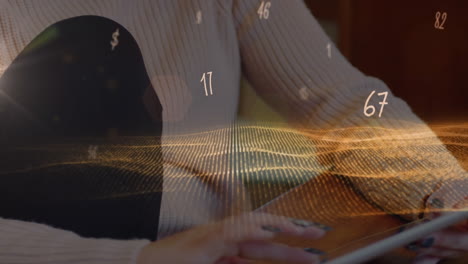 animation of numbers and symbols moving over woman using tablet at home