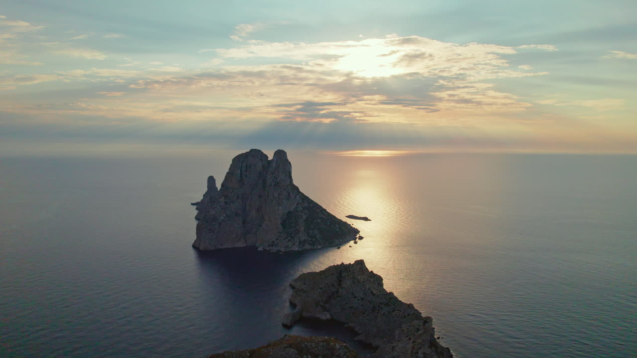 Tranquil Scenery Of Es Vedr&agrave; Island At Sunset In Ibiza, Spain - aerial shot