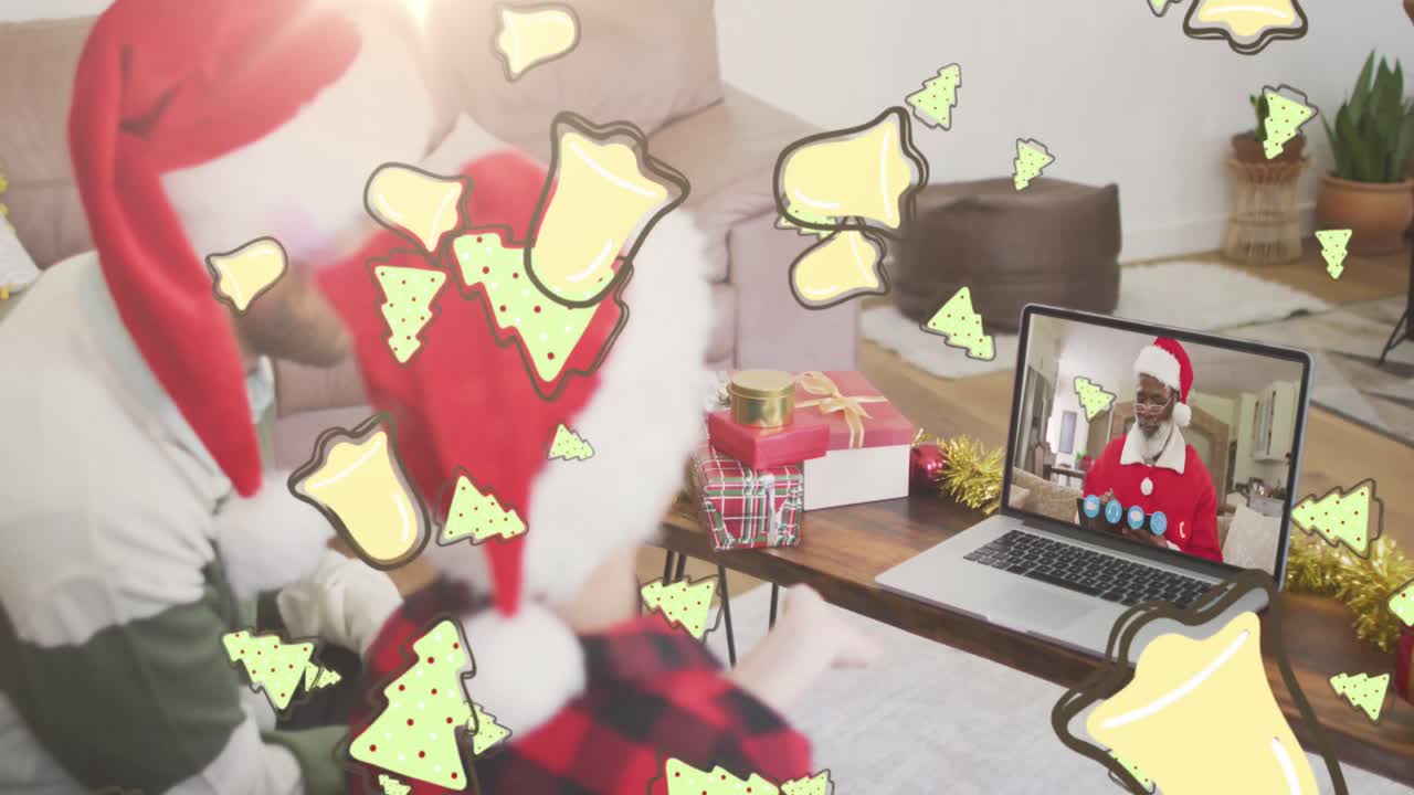 animación de galletas de navidad sobre padre y hijo caucásicos en sombreros de papá noel en llamada de video portátil
