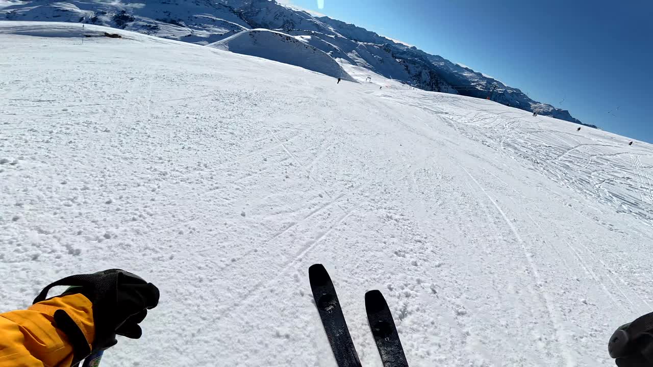 Skiing down a snowy mountain slope