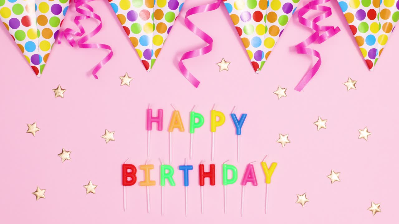 Birthday party flag banners with ribbons appear and move on pastel pink theme with Happy birthday candles. Stop motion
