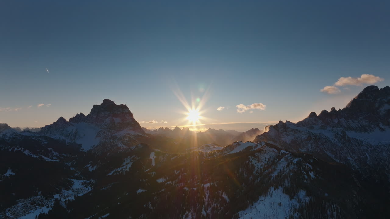 Aerial drone view of snow on the mountains in the Dolomites, Italy