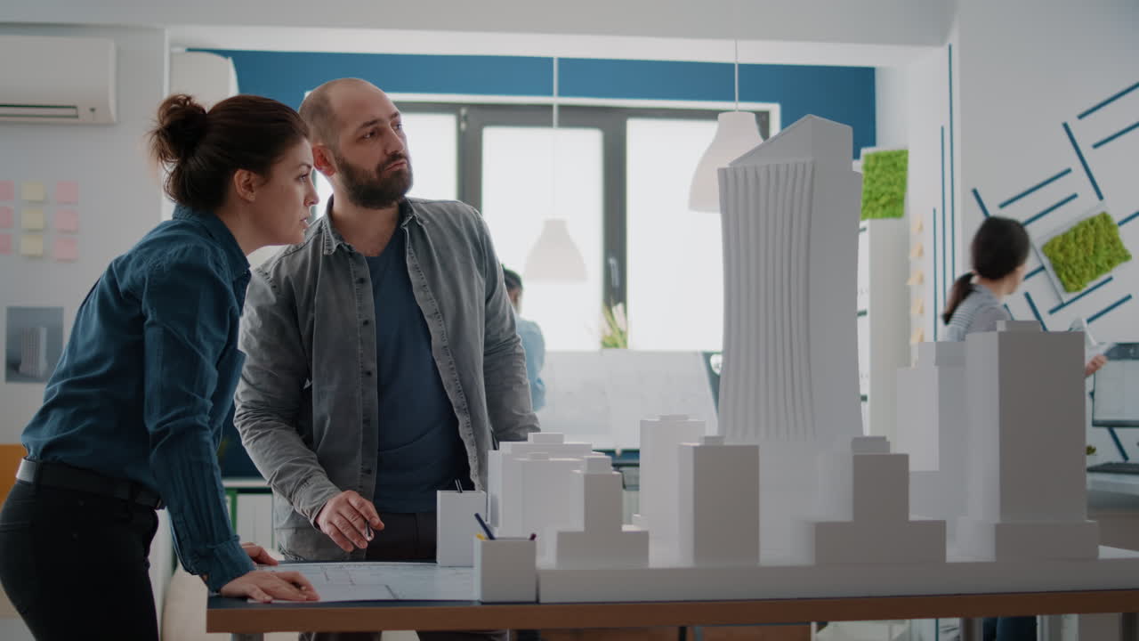 Architects collaborating on a building model design