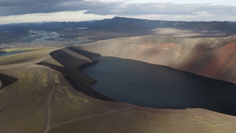aerial panning shot of spectacular ljotipollur volcano crater landscape in iceland