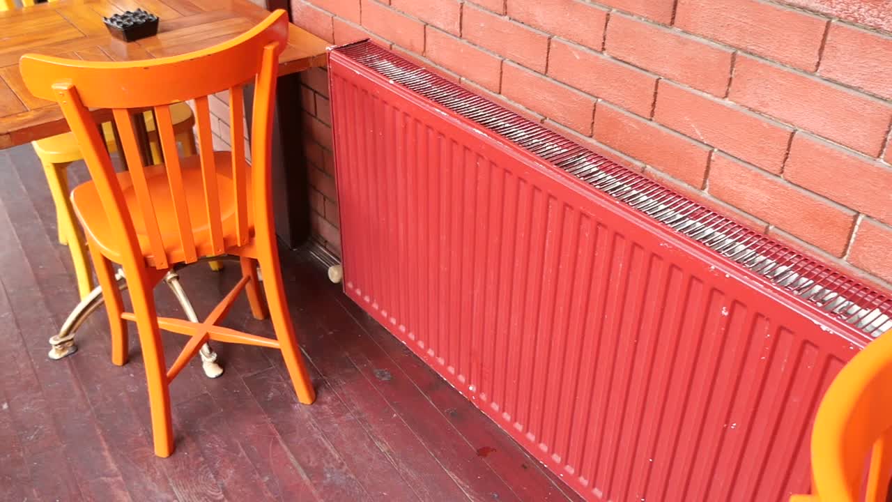 Red Radiator and Orange Chairs