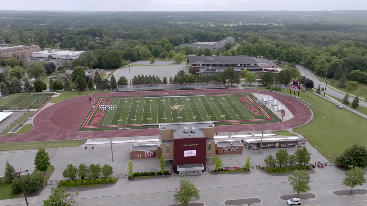 Top Taggart Field, home of the Ferris State University Bulldogs in Big Rapids, Michigan with drone video moving in a circle.