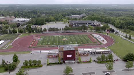 top taggart field, home of the ferris state university bulldogs in big rapids, michigan with drone video moving in a circle.