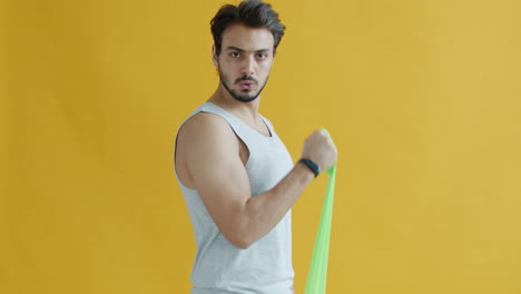 man doing resistance band arm workout
