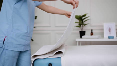 physiotherapist preparing the massage room