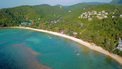 4k-Drone-Footage-of-the-Beach-at-Mae-Nam-on-Koh-Samui-in-Thailand,-Including-Beachfront-Resorts-with-Beautiful-Clouds-in-the-Sky-and-Crystal-Teal-Water