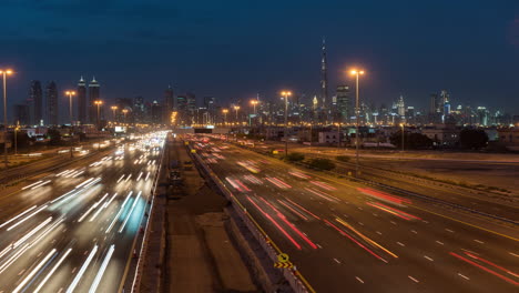 day to night timelapse of dubai skyline skyscrapers with rush hour traffic