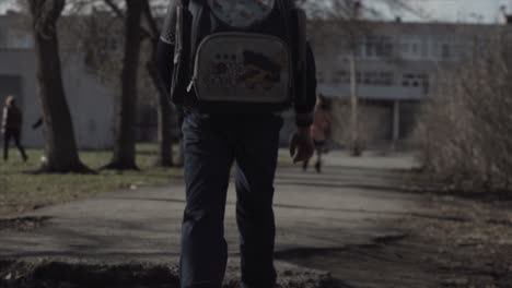 child walking down city street