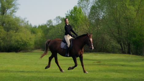 woman horseback riding in a meadow